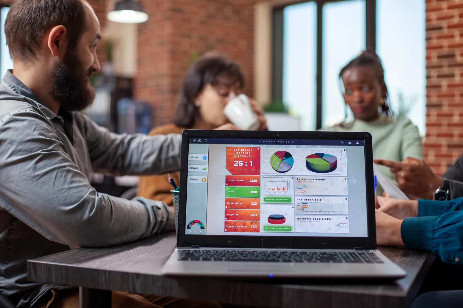 Team reviewing campaign metrics on a laptop