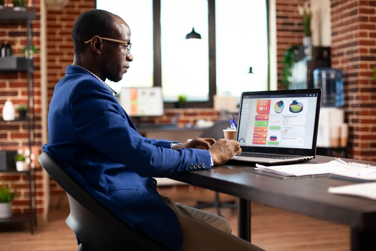 A web analyst configuring form-submission conversion tracking in Google Tag Manager on a laptop