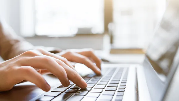 Business blogger writing strategic content that drives organic traffic and leads