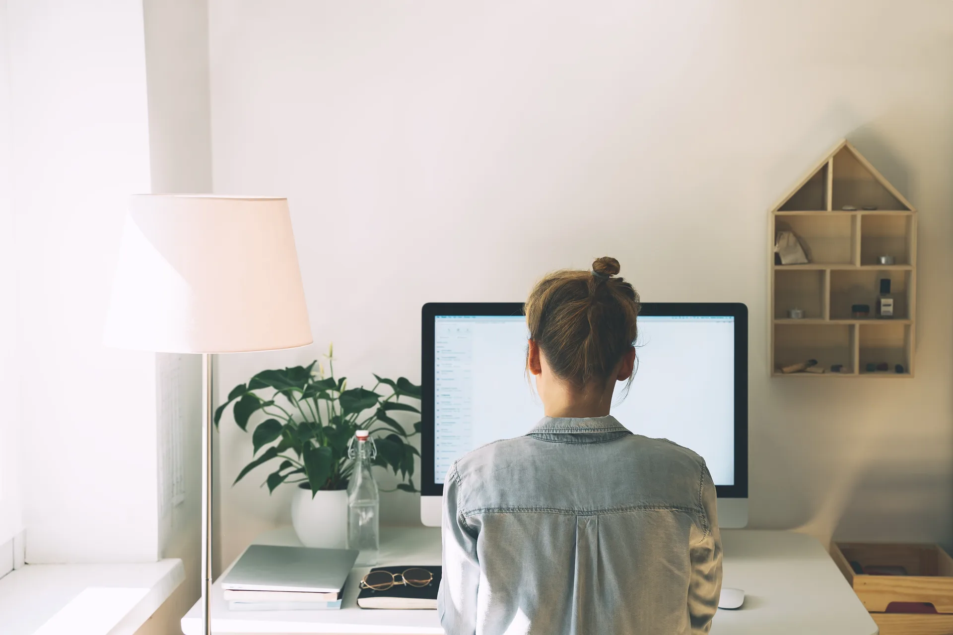 A clean, well-organized creative workspace with a laptop mid-project — the kind of focused work each engagement gets