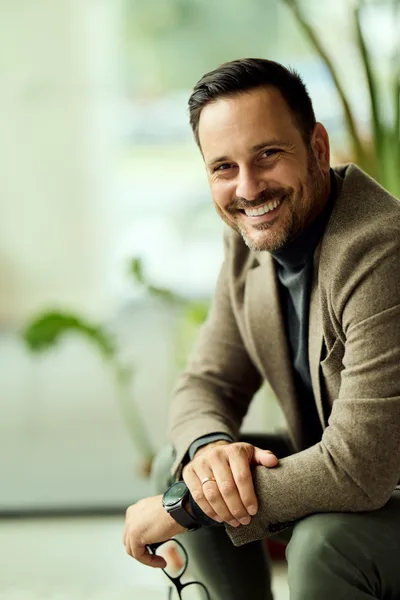 Marcus Hale, mortgage broker at Copperline Mortgage, seated by a bright window and smiling