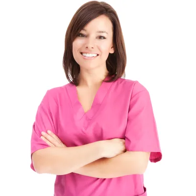 Dr. Bethany Kroll in pink scrubs with arms crossed, smiling