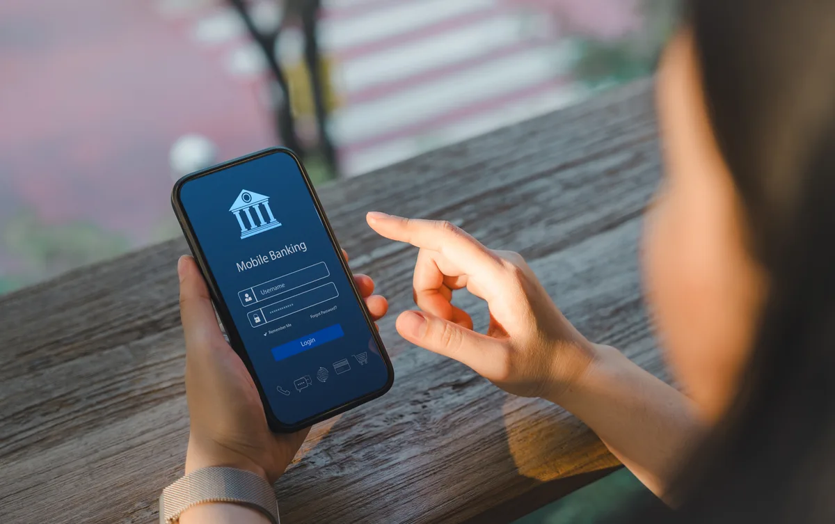 Professional financial advisors reviewing portfolio analytics on digital displays