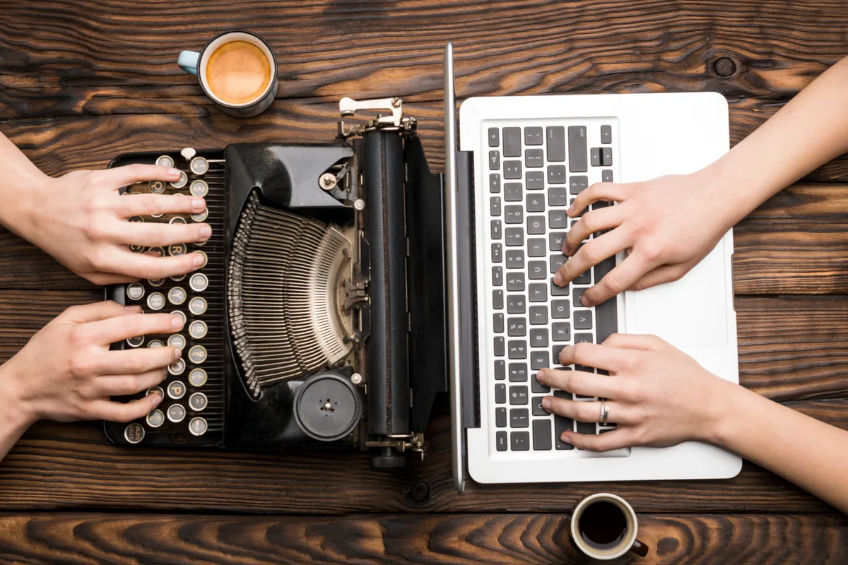 Writing content on typewriter notebook