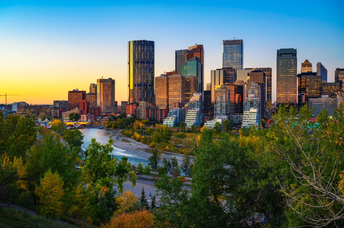Calgary skyline at sunset over the Bow River, Alberta