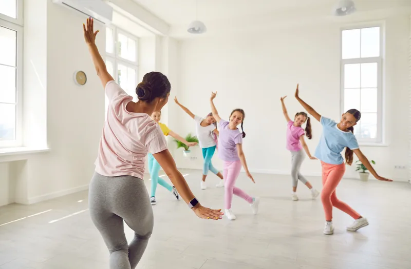 Children in a dance class with their teacher