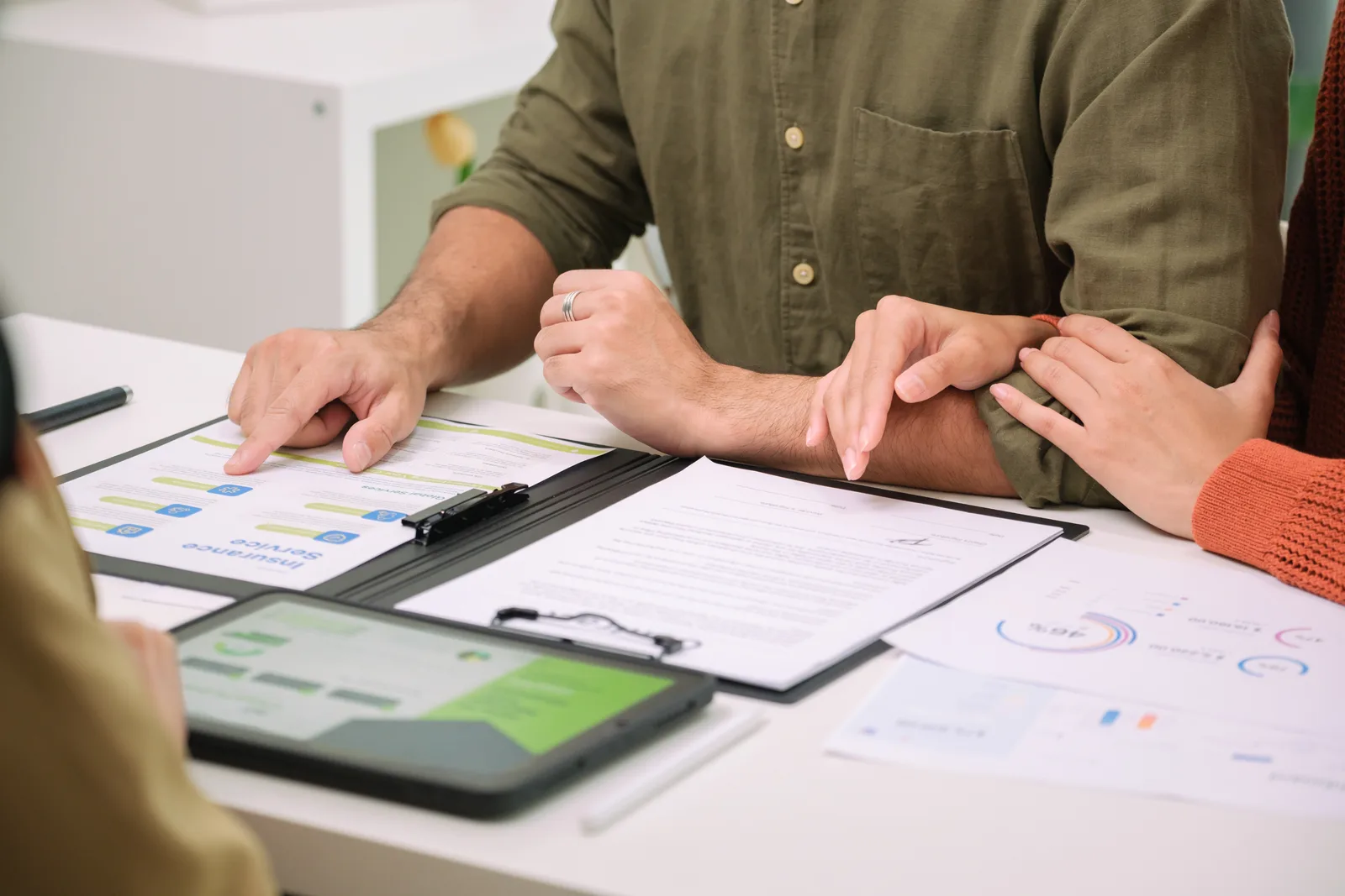 Financial advisor walking a couple through a retirement income plan at a conference table