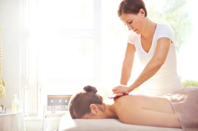 Massage therapist giving a relaxing massage at a day spa
