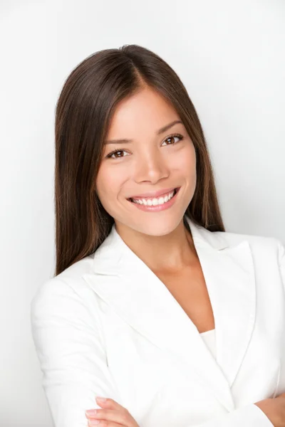 Priya Raman, leasing director, smiling in a white blazer against a light background