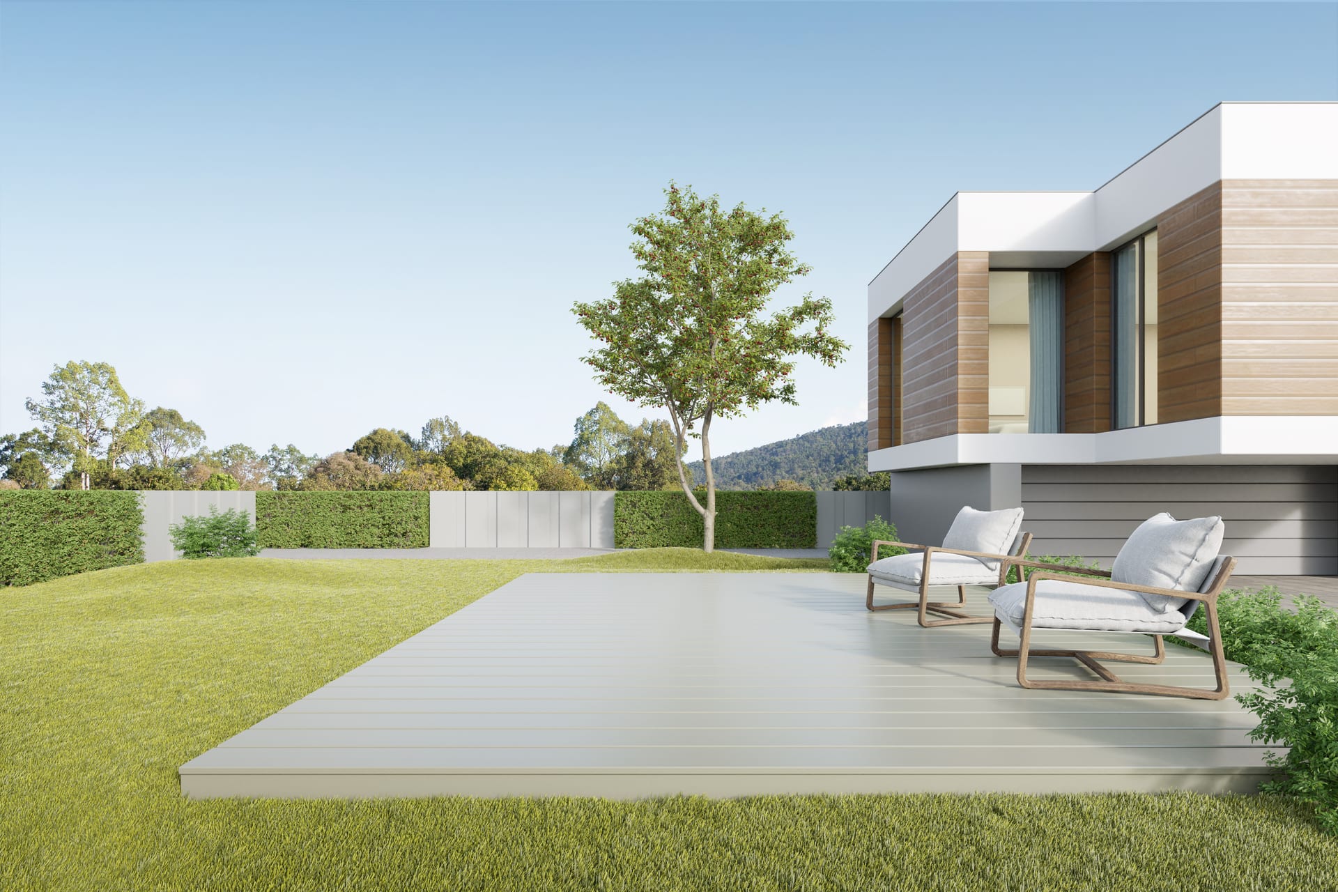 Rendering of a planted amenity terrace with a pale deck and two cushioned lounge chairs under a young tree — artist's impression.